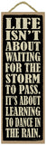Words Of Wisdom Life Isn't About Waiting For The Storm To Pass Wood Sign
